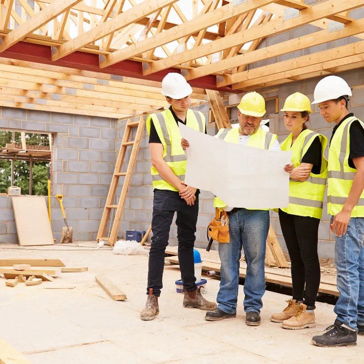 Home builders marketing team reviewing digital campaigns for residential construction projects